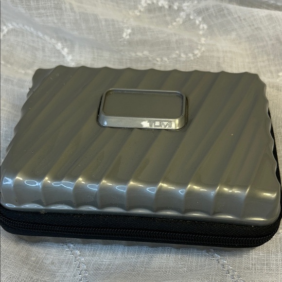 Tumi Handbags - Tumi hard case luggage cosmetic bag filled with goodies for your next trip
